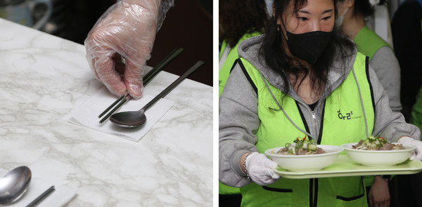 가지런히 놓는 수저. 봉사자들은 청결을 중심으로 음식을 나르며 주민들을 대접했다.